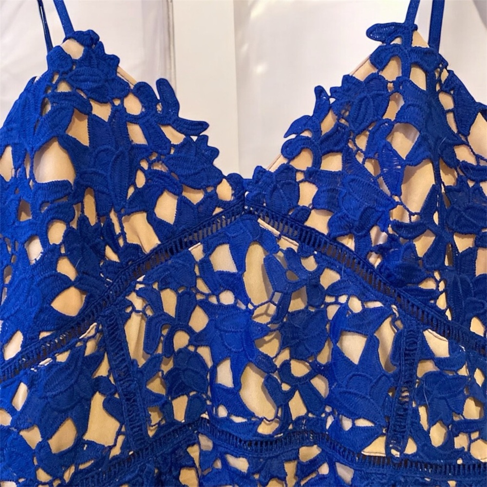 Blue with pink dress, has been used it’s good condition